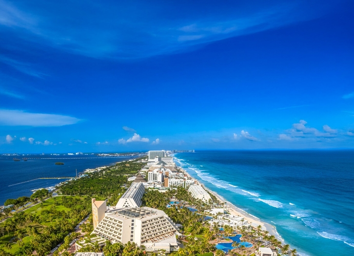 Aerial view of Grand Oasis Cancun hotel and the hotel zone between the sea and lagoon